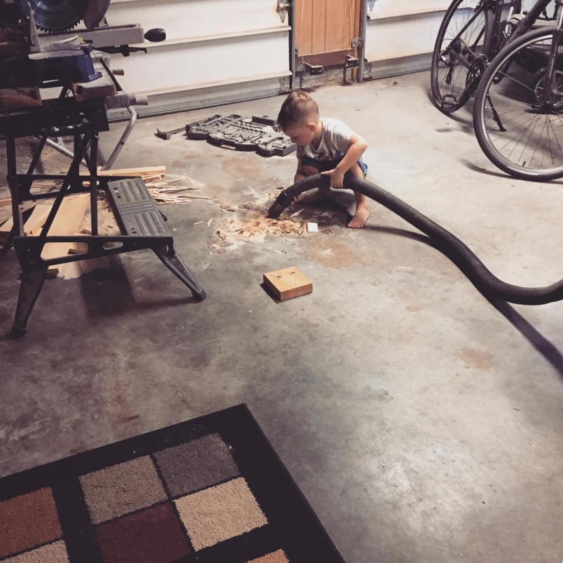 Happy little dude helping daddy clean up. #suprisedaddy #mommyhelpedalittle
