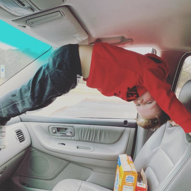 What we do while we wait to pick up the girls. #liljoman #waitingpatiently #upsidedown